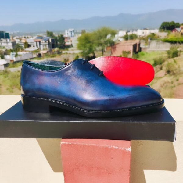 Blue Wholecut Oxford shoes handcrafted in premium leather with sleek seamless design