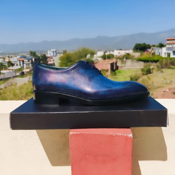 Blue Wholecut Oxford shoes handcrafted in premium leather with sleek seamless design