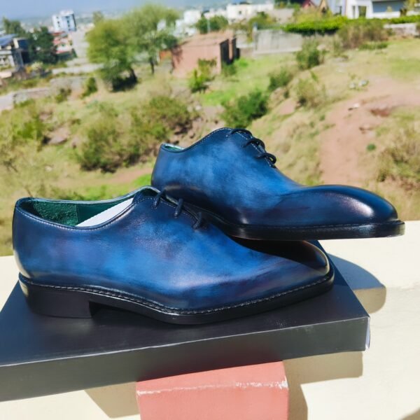 Blue Wholecut Oxford shoes handcrafted in premium leather with sleek seamless design