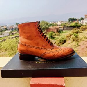 Wingtip Oxford Boots with round toe and Goodyear welt construction